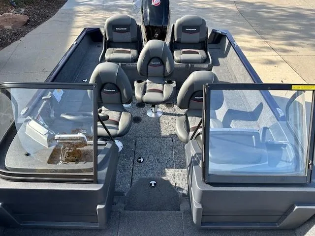 Slide: The Image of 2025 Tracker Pro Guide V-175 Combo boat interior with seating and windshield. - 8