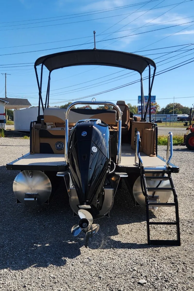 Slide: The Image of 2025 Avalon Platinum LSZ 2385 Cruise Rear Bench pontoon boat with canopy and motor. - 3