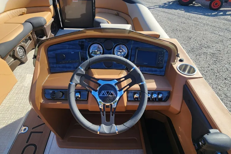 Slide: The Image of 2025 Avalon Platinum LSZ 2385 Cruise Rear Bench dashboard with steering wheel and controls. - 6