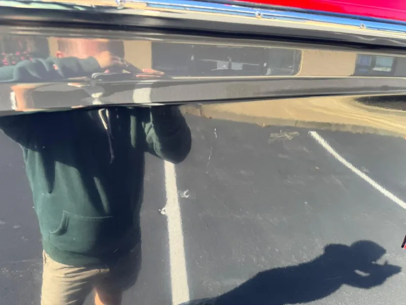 Slide: The Image of Reflection on 2014 MasterCraft X46 boat hull in parking lot. - 10