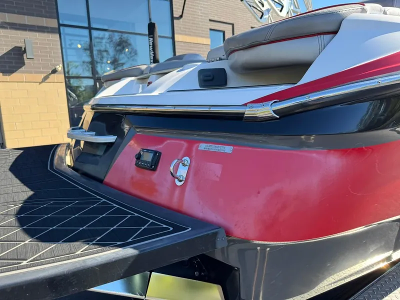 Slide: The Image of 2014 MasterCraft X46 boat rear view with red and white detailing. - 12