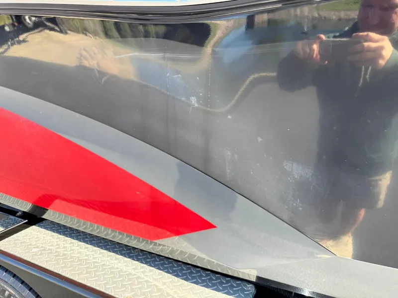 Slide: The Image of Close-up of 2014 MasterCraft X46 boat with red and gray detailing. - 14
