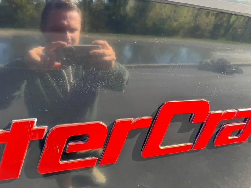 Slide: The Image of Reflection on 2014 MasterCraft X46 boat with red logo. - 15