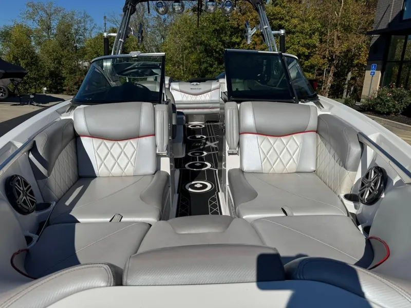 Slide: The Image of 2014 MasterCraft X46 boat interior with gray seating and modern design. - 16