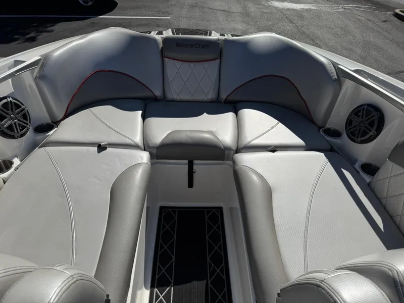 Slide: The Image of 2014 MasterCraft X46 boat interior with white and gray seating. - 17