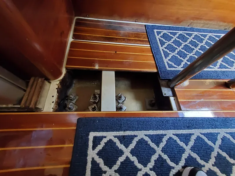 Slide: The Image of Interior view of 1987 Pearson 31-2 sailboat, showing floorboards and structural bolts. - 13