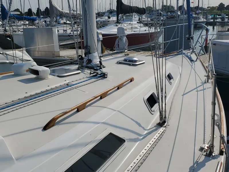 Slide: The Image of 1987 Pearson 31-2 sailboat deck with rigging in marina setting. - 2