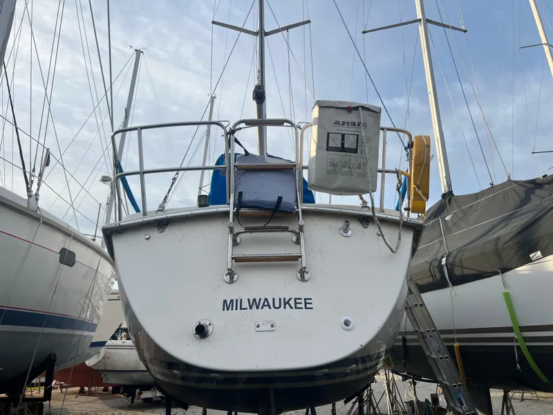Slide: The Image of Pearson 31-2 sailboat from 1987 named Milwaukee, docked among other boats. - 26