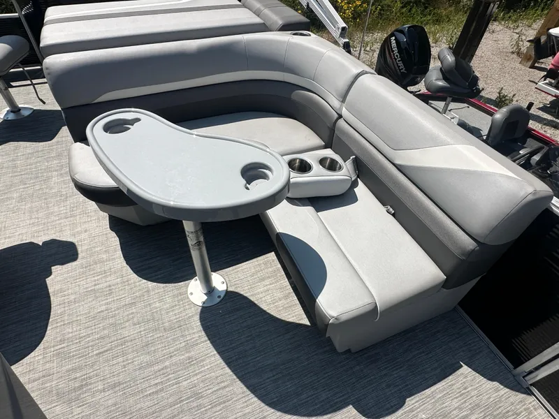 Slide: The Image of 2020 Bennington SX 20 SFX boat interior with gray seating and table. - 10
