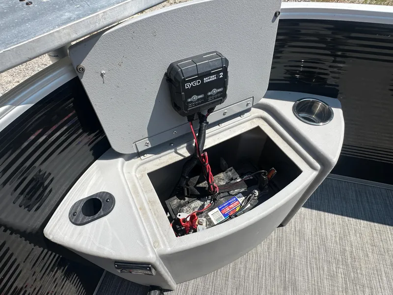 Slide: The Image of 2020 Bennington SX 20 SFX boat battery compartment with charger and wiring. - 11