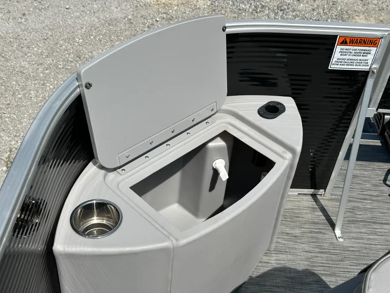 Slide: The Image of 2020 Bennington SX 20 SFX boat console with cup holder and storage compartment. - 12
