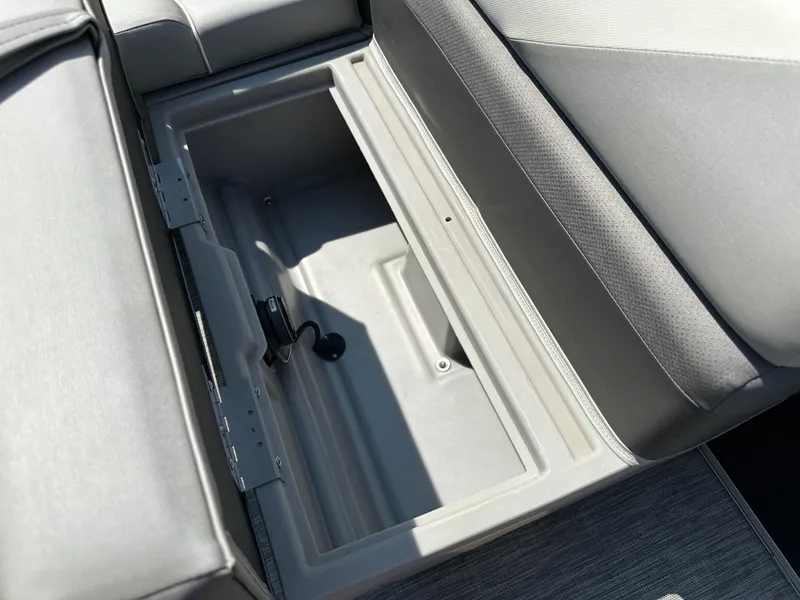 Slide: The Image of Open storage compartment in 2020 Bennington SX 20 SFX boat seat. - 13