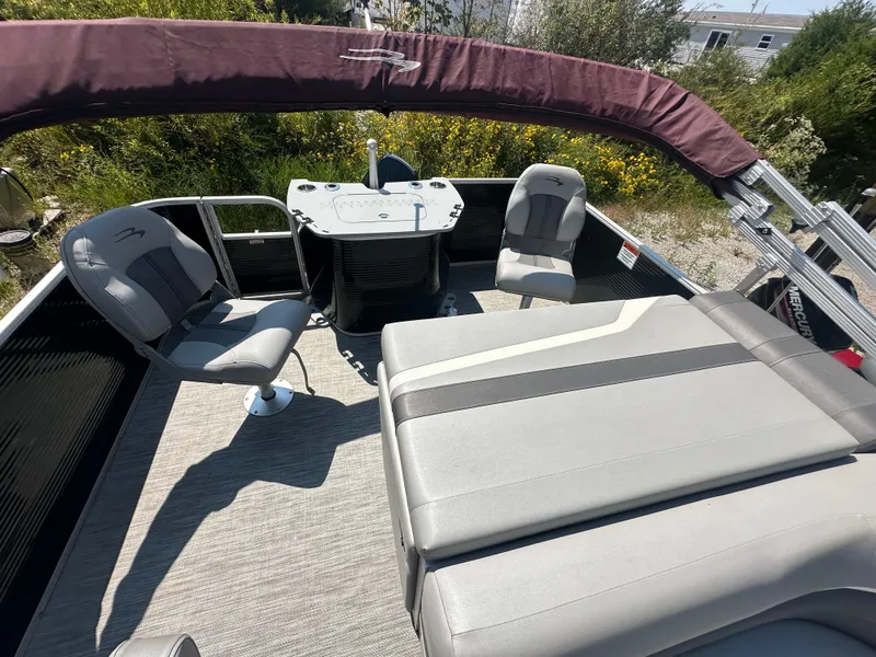 Slide: The Image of 2020 Bennington SX 20 SFX pontoon boat interior with seating and table. - 17