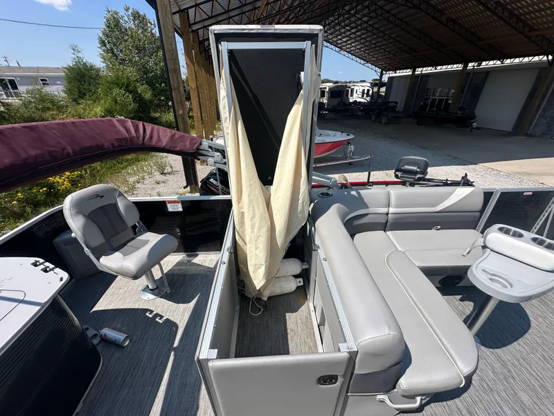 Slide: The Image of 2020 Bennington SX 20 SFX pontoon boat interior with seating and storage. - 18