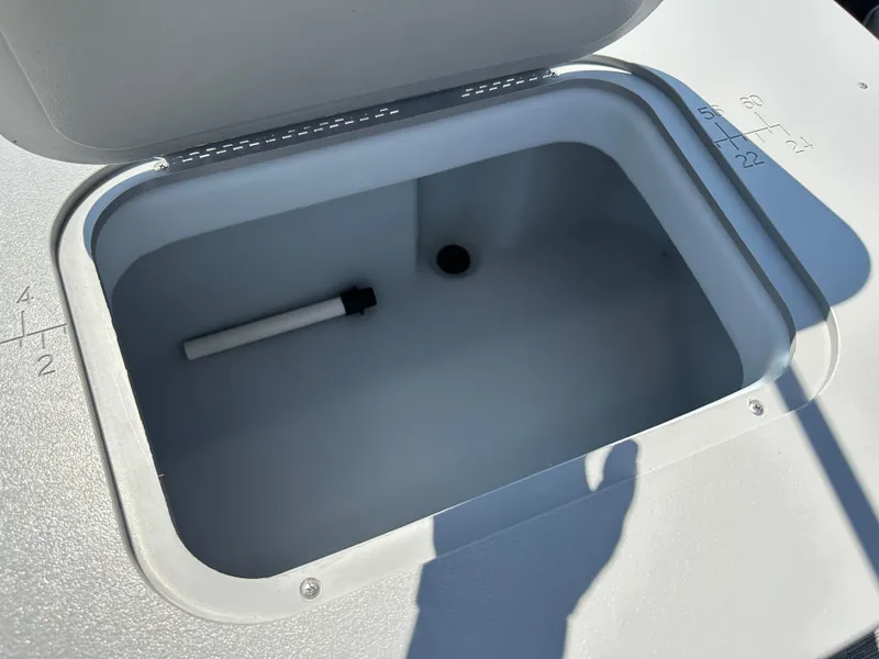 Slide: The Image of Open storage compartment on 2020 Bennington SX 20 SFX boat. - 19