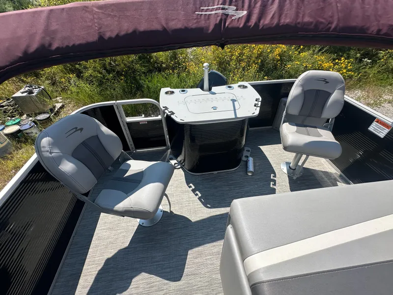 Slide: The Image of 2020 Bennington SX 20 SFX pontoon boat interior with seating and console. - 21