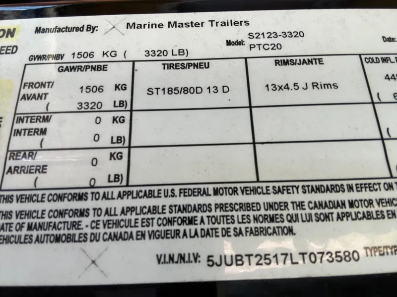 Slide: The Image of Marine Master Trailers label with specifications for model S2123-3320, PTC20, and VIN details. - 22