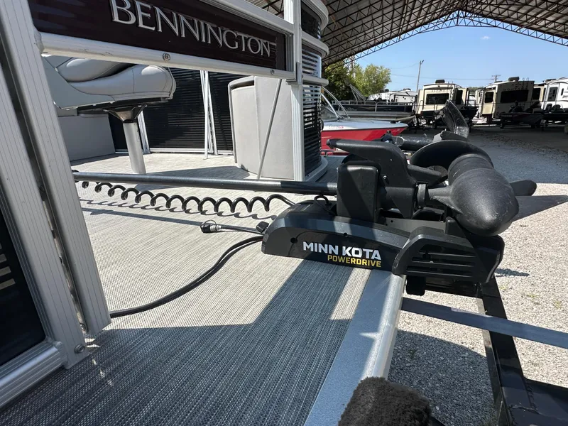 Slide: The Image of 2020 Bennington SX 20 SFX pontoon with Minn Kota PowerDrive motor in a storage area. - 3