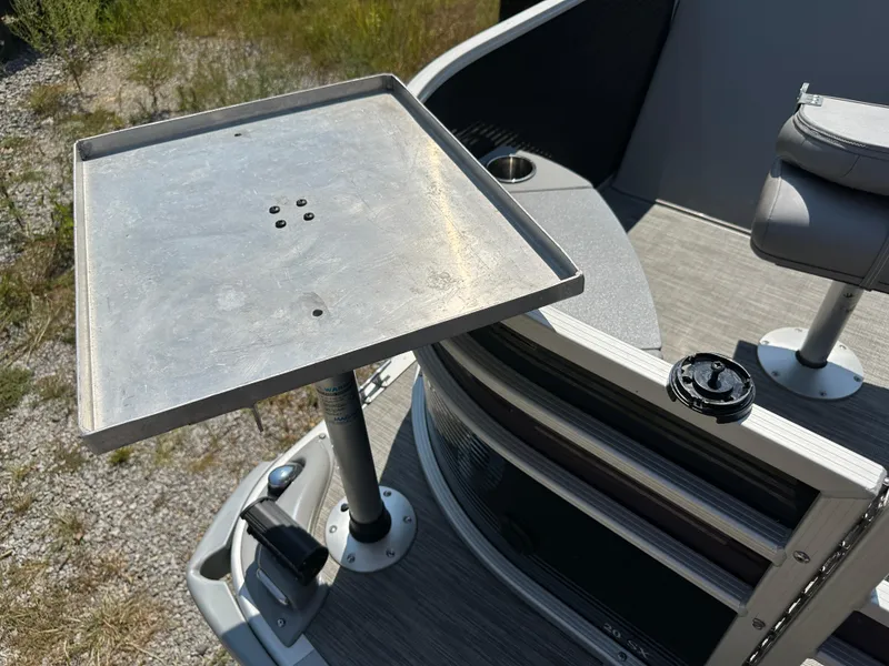 Slide: The Image of 2020 Bennington SX 20 SFX boat with metal table and seating area. - 8