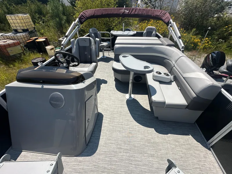 Slide: The Image of 2020 Bennington SX 20 SFX pontoon boat with spacious seating and modern interior design. - 9
