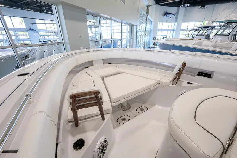 Slide: The Image of 2025 Sportsman Open 352 boat interior with white seating and modern design. - 14