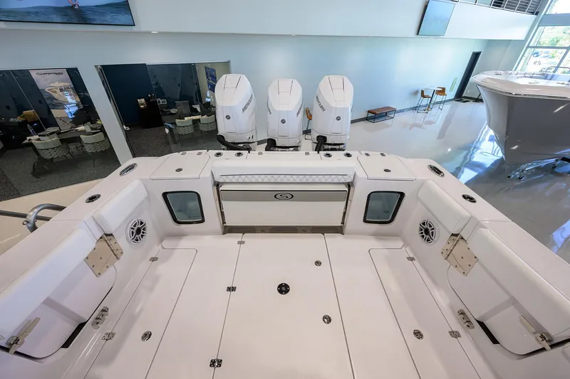Slide: The Image of 2025 Sportsman Open 352 boat interior with triple engines, spacious deck, and modern design. - 21