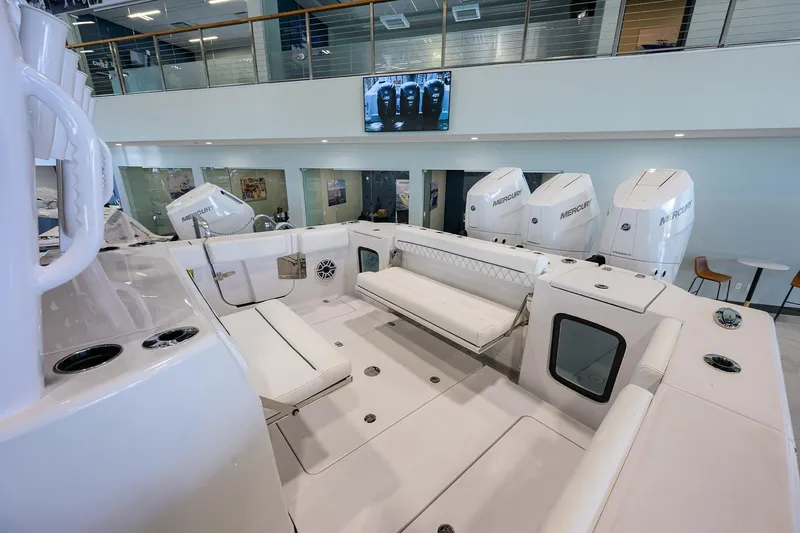 Slide: The Image of 2025 Sportsman Open 352 boat interior with seating and multiple outboard engines. - 26