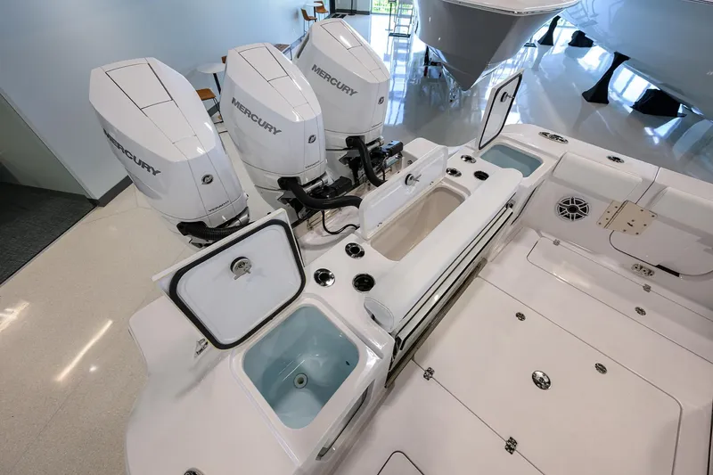 Slide: The Image of 2025 Sportsman Open 352 boat with triple Mercury engines and open storage compartments. - 35