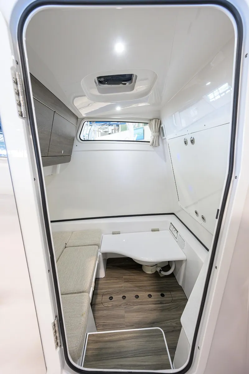 Slide: The Image of 2025 Sportsman Open 352 cabin interior with seating and storage. - 38