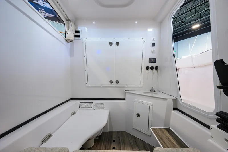 Slide: The Image of Interior cabin of 2025 Sportsman Open 352 boat, featuring modern design and storage compartments. - 42