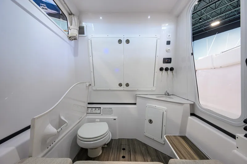 Slide: The Image of Interior of 2025 Sportsman Open 352 boat, featuring a modern bathroom with sleek design. - 43