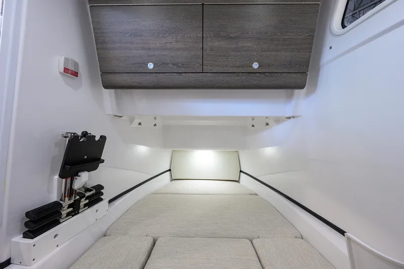 Slide: The Image of 2025 Sportsman Open 352 cabin interior with modern design and comfortable bedding. - 45