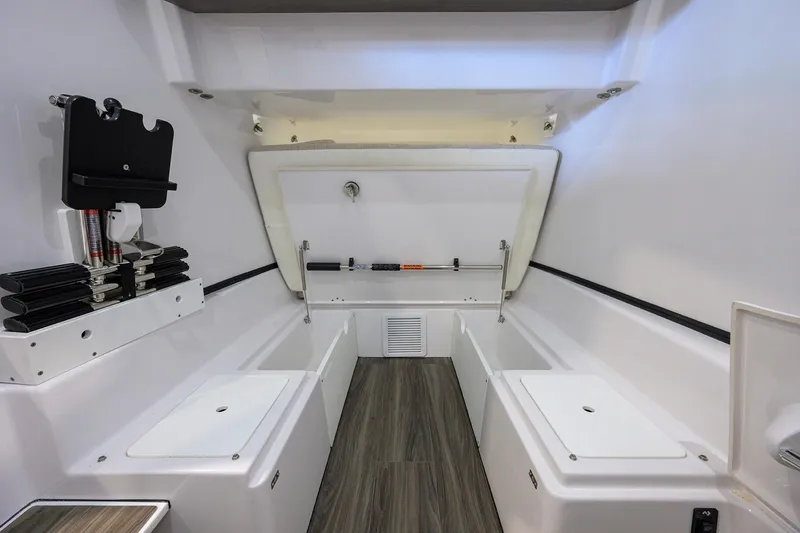 Slide: The Image of 2025 Sportsman Open 352 boat interior with storage compartments and sleek design. - 46