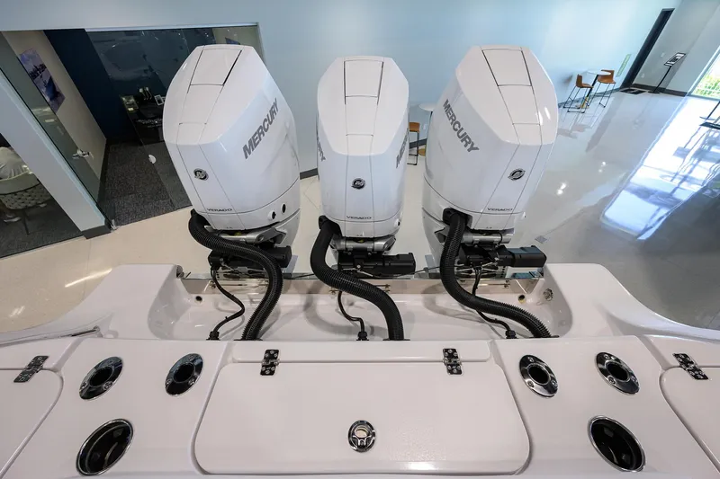 Slide: The Image of 2025 Sportsman Open 352 boat with triple Mercury outboard engines in showroom. - 48