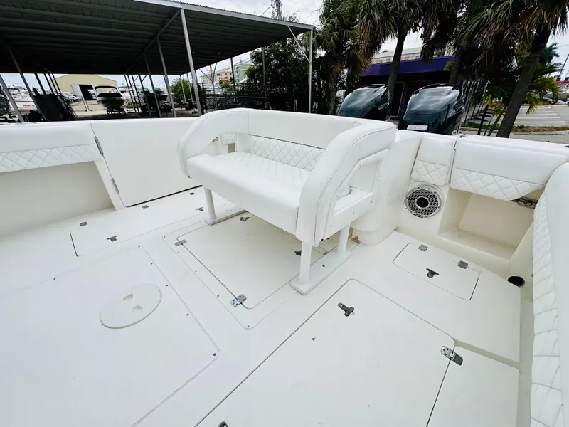 Slide: The Image of 2004 Intrepid 370 Open boat with white seating and spacious deck area. - 10