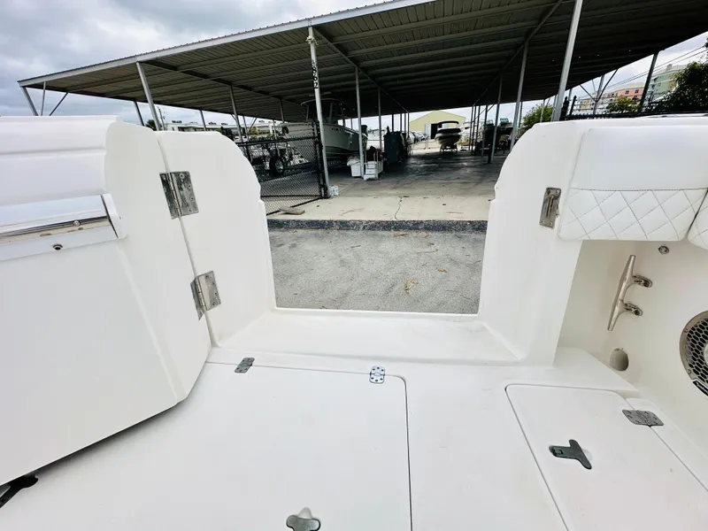 Slide: The Image of 2004 Intrepid 370 Open boat interior with open deck and storage compartments. - 12