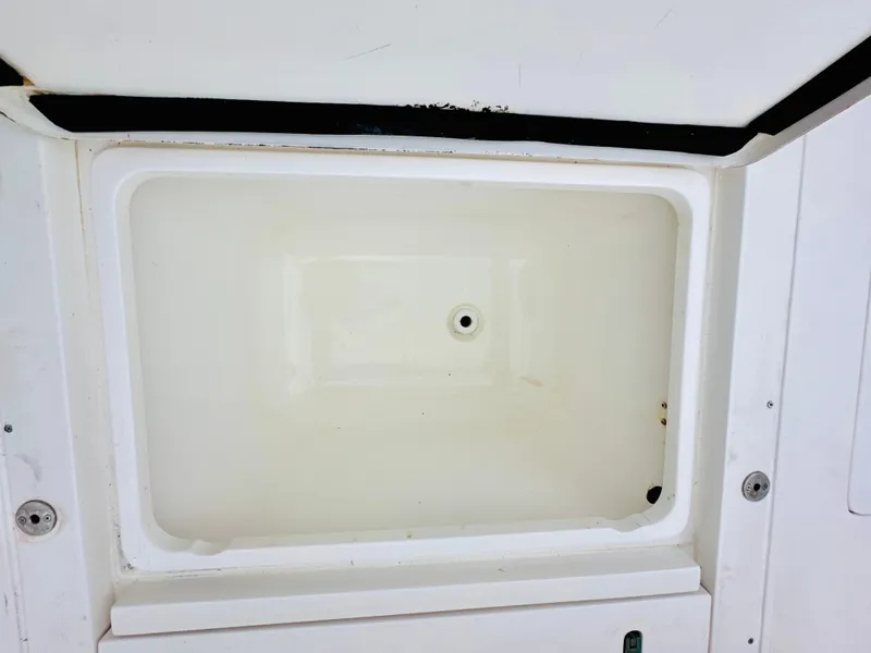 Slide: The Image of Open storage compartment on 2004 Intrepid 370 Open boat. - 14