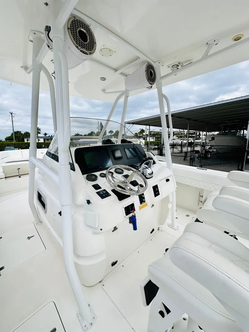 Slide: The Image of 2004 Intrepid 370 Open boat cockpit with modern controls and seating. - 16