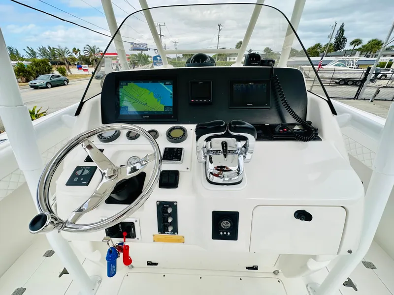 Slide: The Image of 2004 Intrepid 370 Open boat helm with navigation screens and controls. - 17