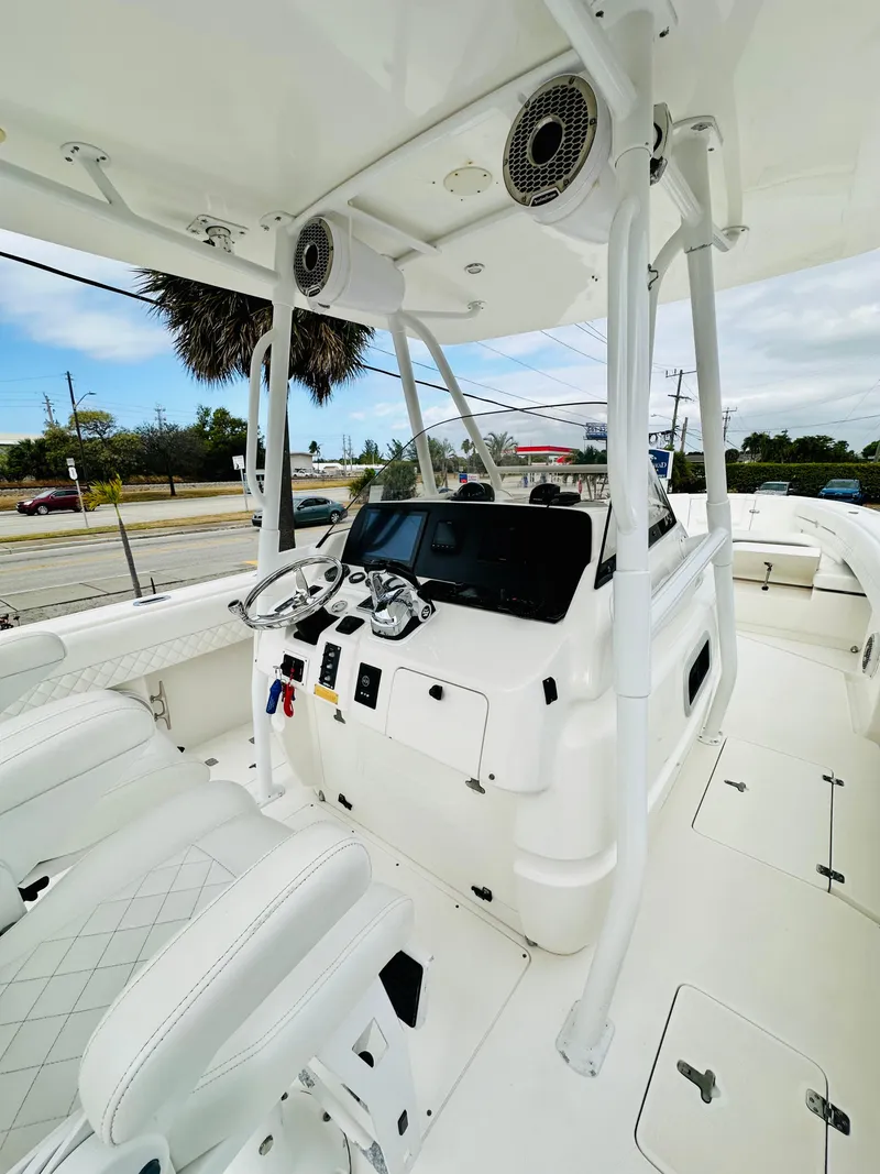 Slide: The Image of 2004 Intrepid 370 Open boat interior with modern helm and seating. - 18