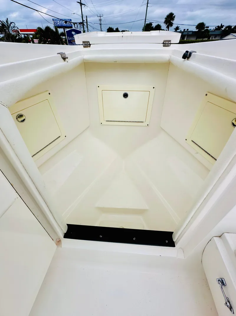 Slide: The Image of 2004 Intrepid 370 Open boat interior with storage compartments. - 22