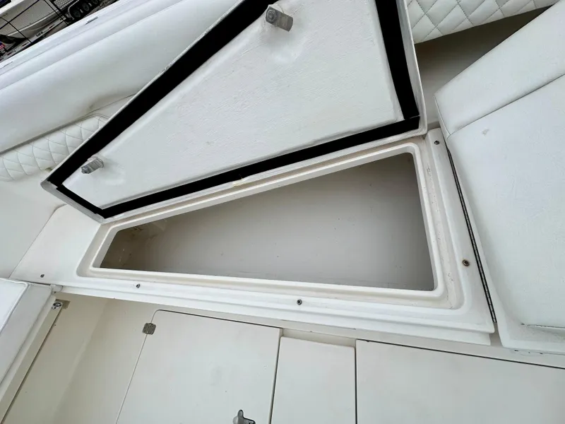 Slide: The Image of Open storage compartment on 2004 Intrepid 370 Open boat. - 25
