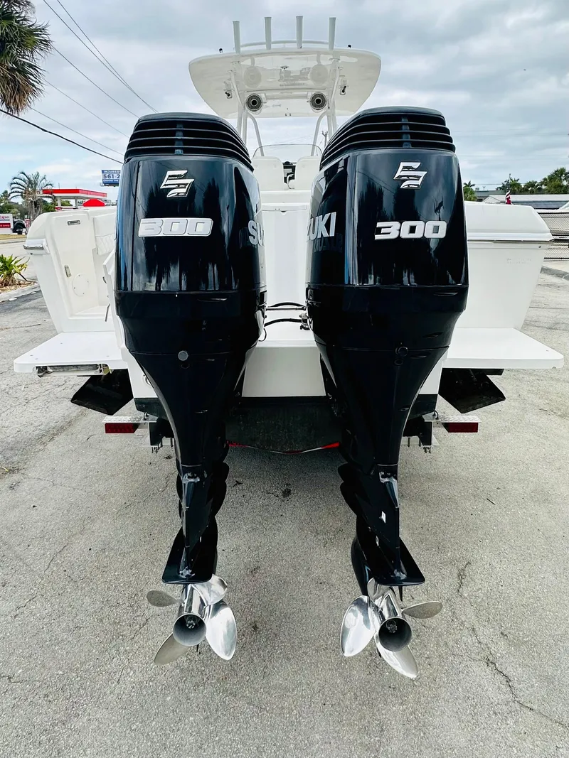 Slide: The Image of 2004 Intrepid 370 Open with twin Suzuki 300 outboard engines, rear view. - 3