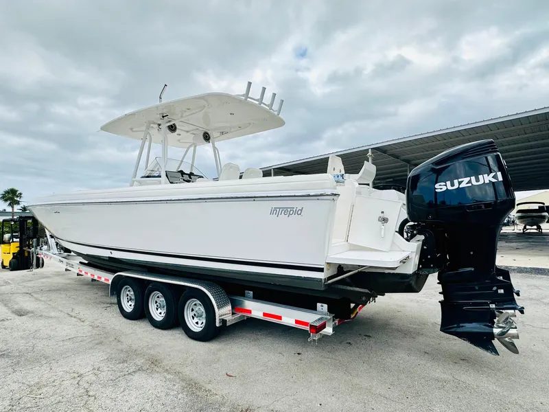 Slide: The Image of 2004 Intrepid 370 Open boat on trailer with Suzuki outboard motor. - 4