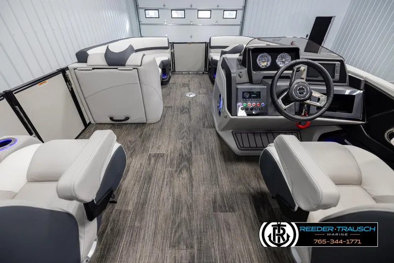Slide: The Image of Interior of 2025 Avalon Catalina QL pontoon boat with modern seating and control panel. - 17