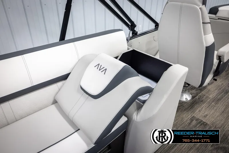 Slide: The Image of 2025 Avalon Catalina QL boat interior with white and gray seating, Reeder-Trausch Marine logo. - 24