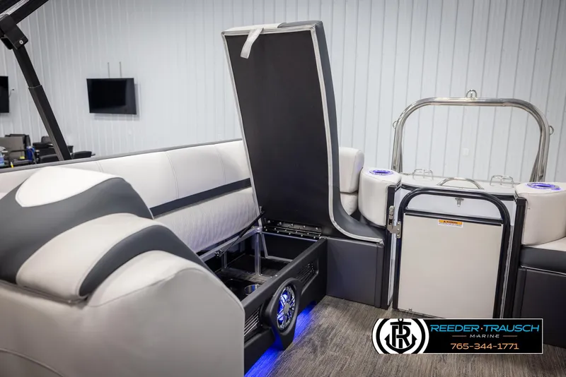 Slide: The Image of 2025 Avalon Catalina QL boat interior with open storage compartment and modern seating. - 26