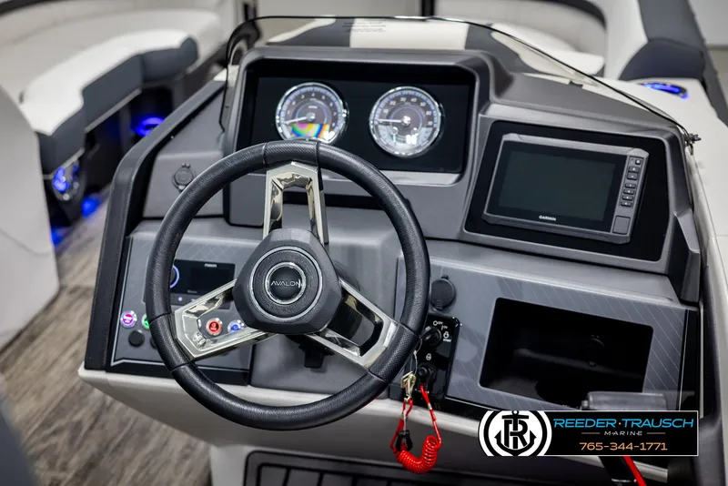 Slide: The Image of 2025 Avalon Catalina QL boat dashboard with steering wheel and digital display. - 27