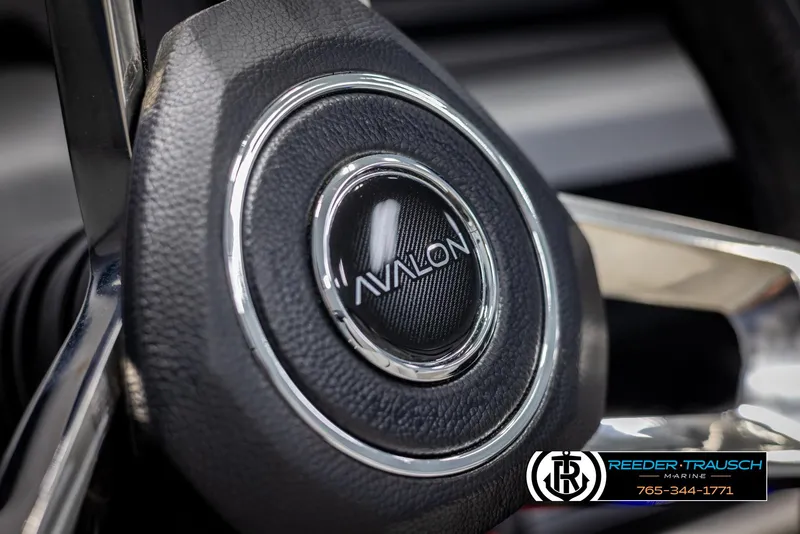 Slide: The Image of Steering wheel of 2025 Avalon Catalina QL boat with logo detail. - 30
