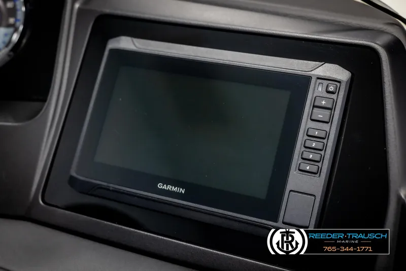 Slide: The Image of Garmin display on 2025 Avalon Catalina QL boat dashboard, featuring control buttons. - 33